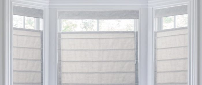 Roman shades in a window